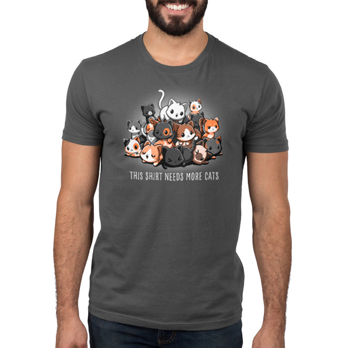 Premium Cotton T-shirt_TeeTurtle charcoal gray Needs More Cats apparel  featuring a pile of different colored cats with various expressions, caption reads "this shirt needs more cats".