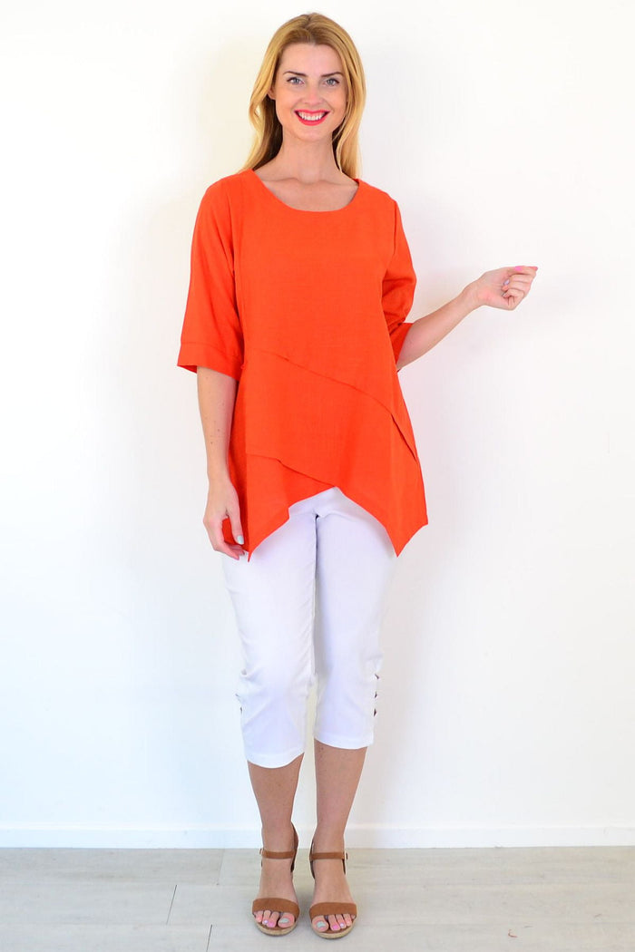 Orange layered linen blend tunic top by Ruby Rain, shown on a hanger with a relaxed fit and casual style.