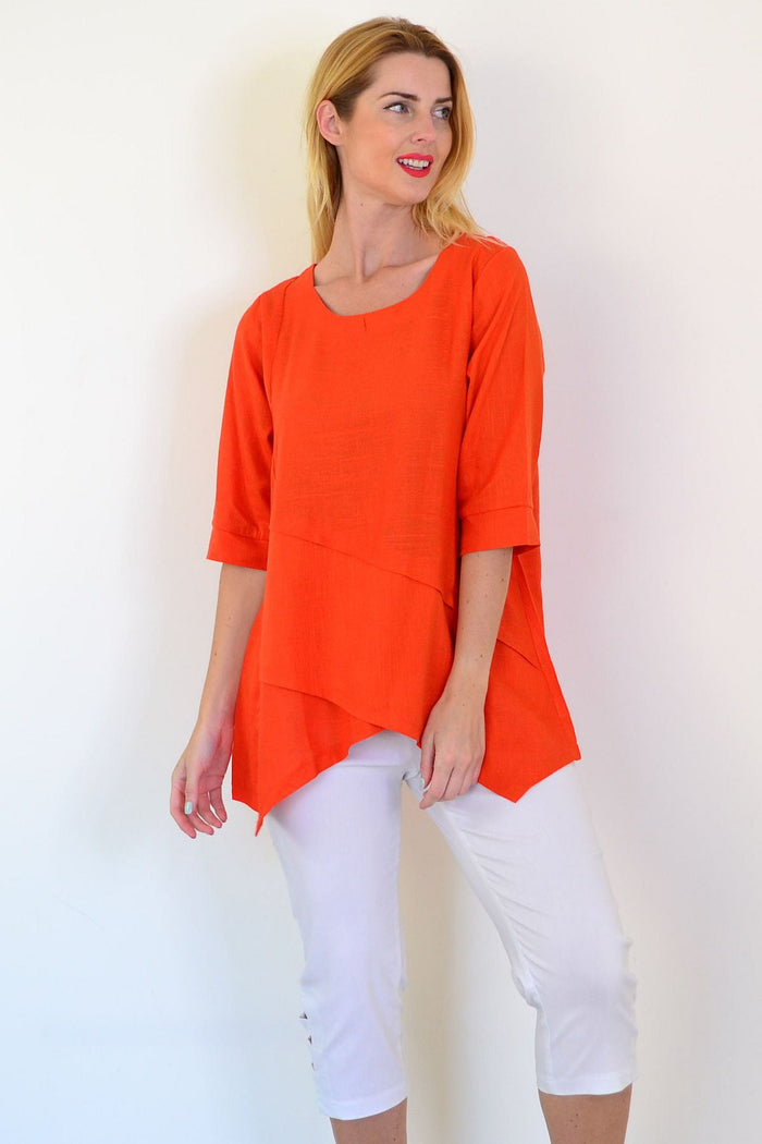 Orange layered linen blend tunic top by Ruby Rain, showcasing its relaxed fit and stylish design on a model.