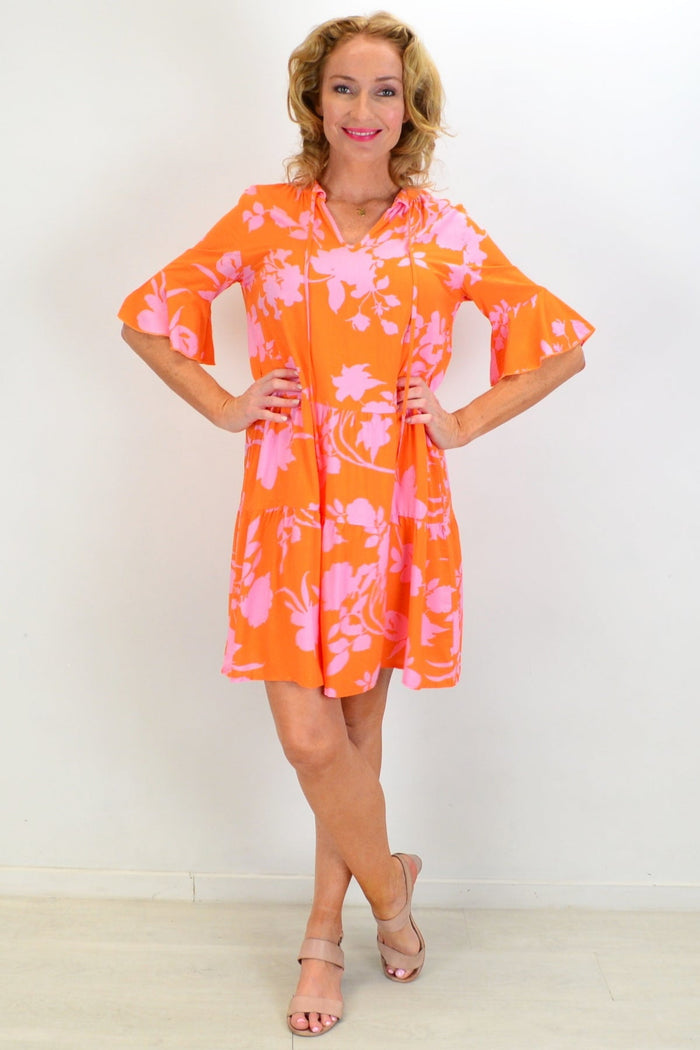 Orange Maple Leaf Tiered Dress Tunic by Peony, featuring layered fabric and floral print, displayed on a hanger.
