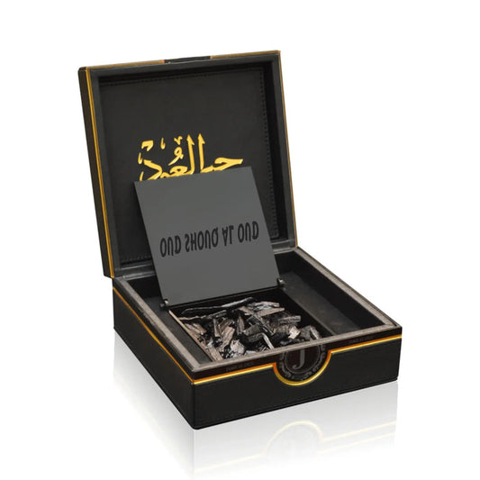 Luxury Jamr Al Oud black gift box with oud wood chips and gold Arabic accents