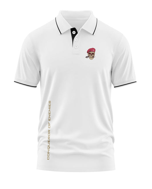 White men's polo t-shirt with skull and beret logo, black trim, and 'Conqueror of Enemies' text
