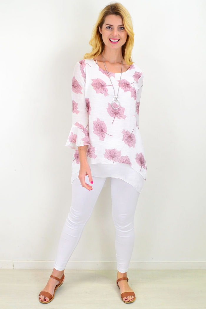 Pink maple leaf layered tunic top by Caroline Morgan, featuring a relaxed fit and floral leaf pattern, displayed on a hanger.