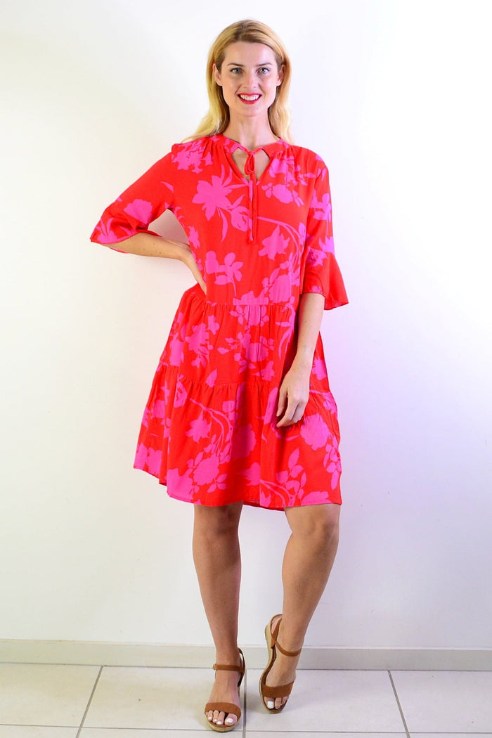 Pink Maple Leaf Tiered Dress Tunic by Peony, featuring layered fabric and leaf pattern, displayed on a hanger.