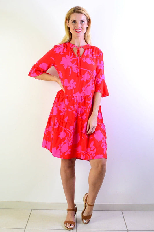 Pink Maple Leaf Tiered Dress Tunic by Peony, featuring layered fabric and leaf pattern, displayed on a hanger.