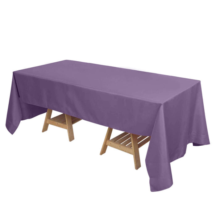 Purple tablecloth draped over a wooden table