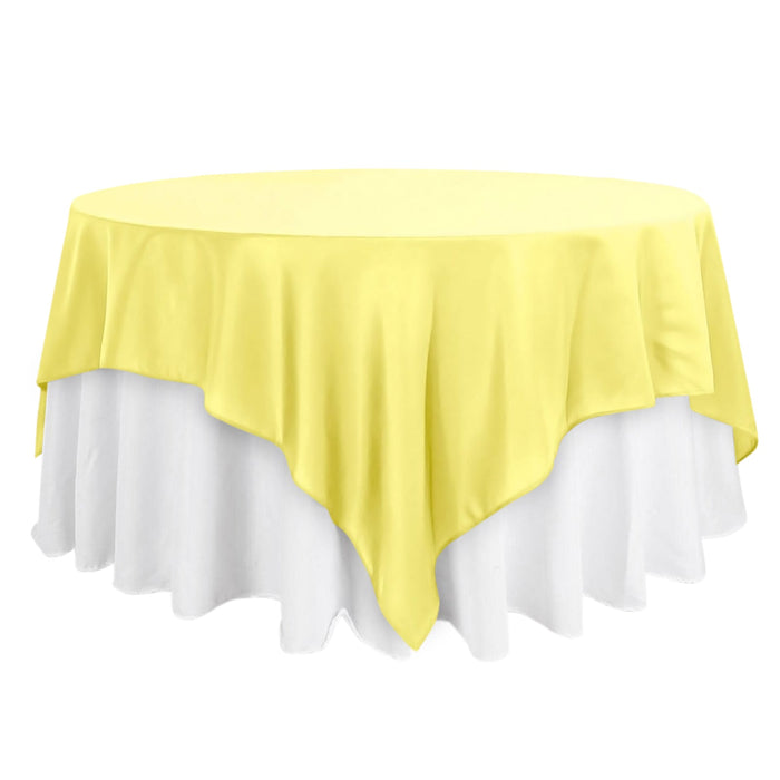 Yellow tablecloth draped elegantly over a round table