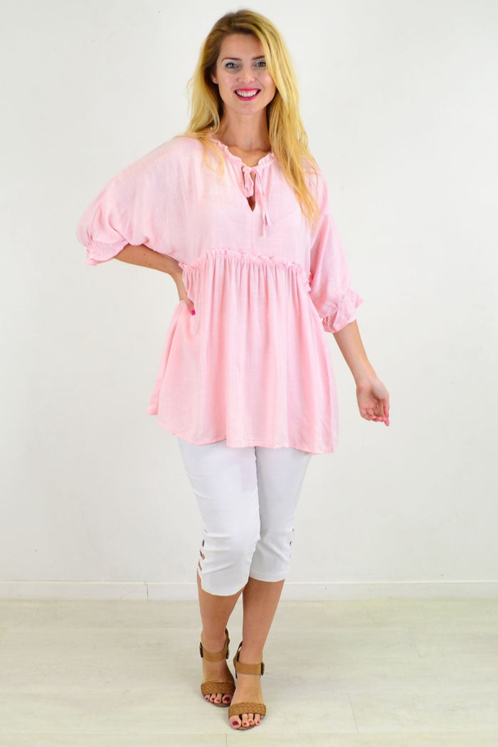 Powder pink relaxed fit tunic blouse from Hourglass, featuring a casual, comfortable design and flowing fabric.