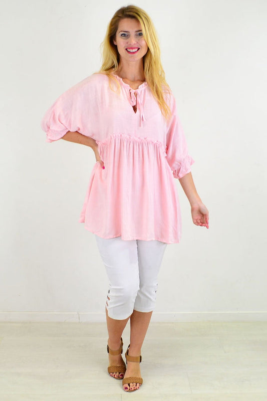 Powder pink relaxed fit tunic blouse from Hourglass, featuring a casual, comfortable design and flowing fabric.
