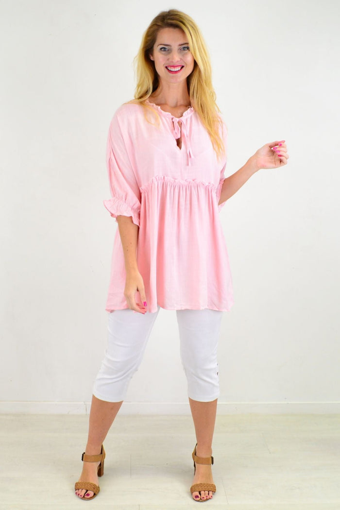 Powder pink Hourglass relaxed fit tunic blouse with long sleeves and a flowing, comfortable silhouette.