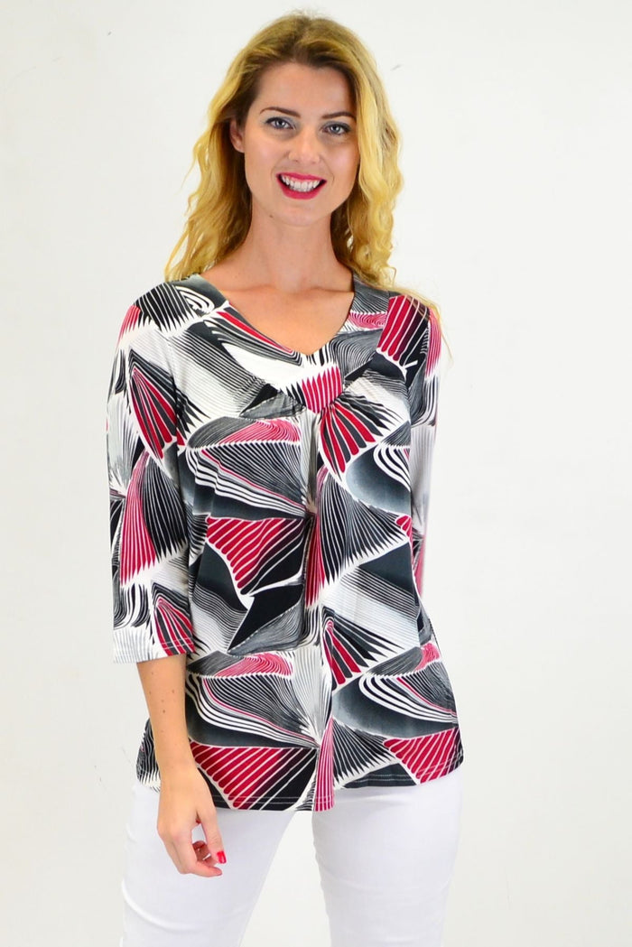 Red Matrics stretch tunic top from I Love Tunics, shown on a hanger with a close-up of fabric and fit details.