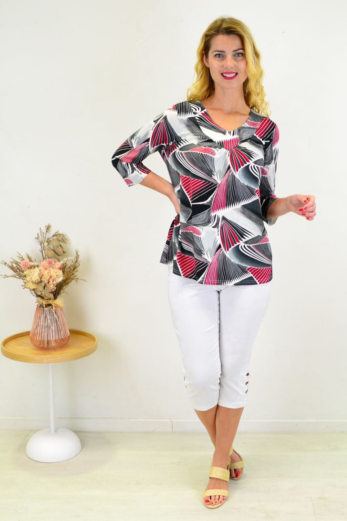 Red Matrics stretch tunic top from I Love Tunics, featuring a comfortable fit and stylish design, displayed on a hanger.