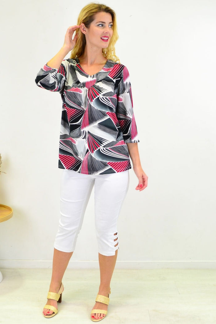 Red Matrics Stretch Tunic Top from I Love Tunics displayed on a hanger, showcasing its vibrant color and comfortable fit.