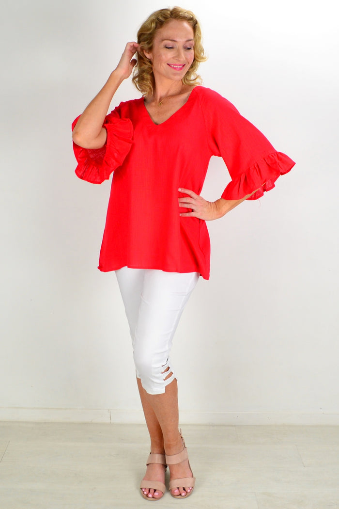 Red Razzle Dazel ruffle sleeve tunic top by Hourglass, showing its vibrant color and stylish ruffle details.