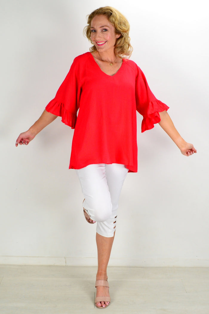 Red Razzle Dazel ruffle sleeve tunic top by Hourglass, featuring a vibrant color and stylish ruffle details on the sleeves.