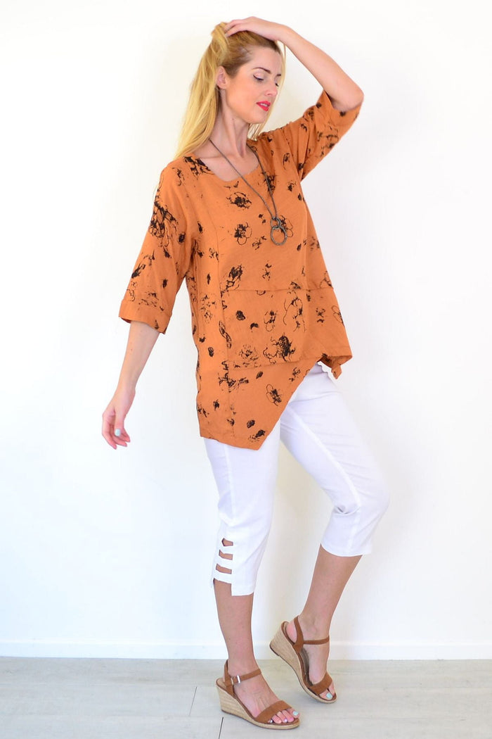 Rust layered linen blend tunic top by Ruby Rain featuring a relaxed fit and lightweight fabric, displayed on a hanger.