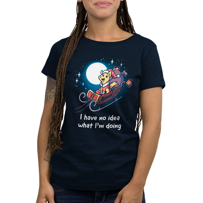 Premium Cotton T-shirt_TeeTurtle navy blue Santa Paws apparel featuring a dog dressed as Santa riding in a sleigh in the moonlit sky with presents flying off, and the caption, "I Have No Idea What I'm Doing".
