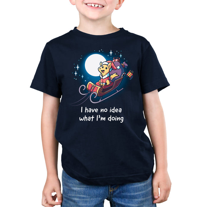 Premium Cotton T-shirt_TeeTurtle navy blue Santa Paws apparel featuring a dog dressed as Santa riding in a sleigh in the moonlit sky with presents flying off, and the caption, "I Have No Idea What I'm Doing".