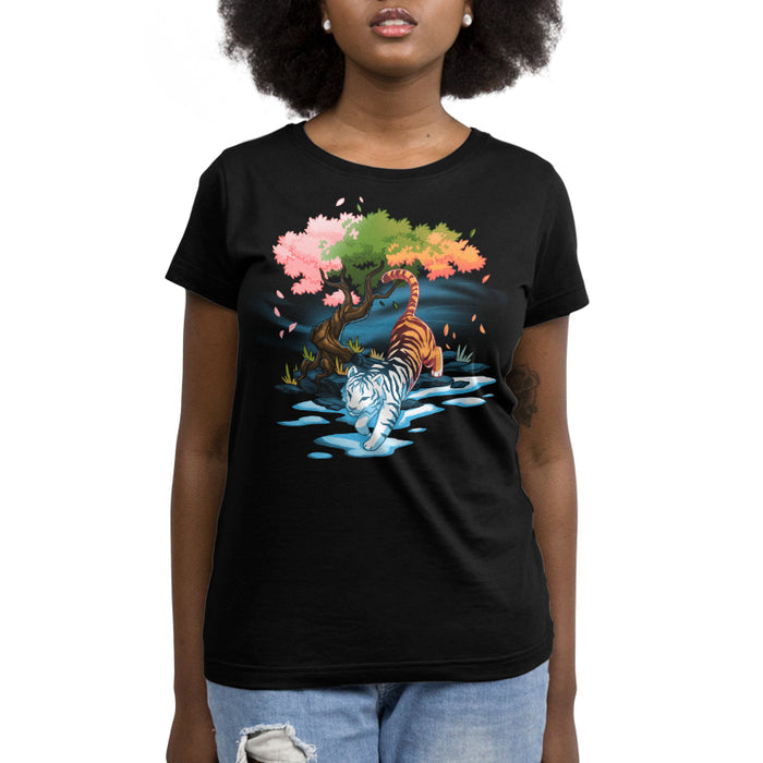 Premium Cotton T-shirt_TeeTurtle black Season Keeper apparel featuring a majestic tiger. The front half of the tiger is white and is stepping into winter, and snow, while the back half is orange. It is walking under a tree with different color leaves representing spring, summer, and fall.