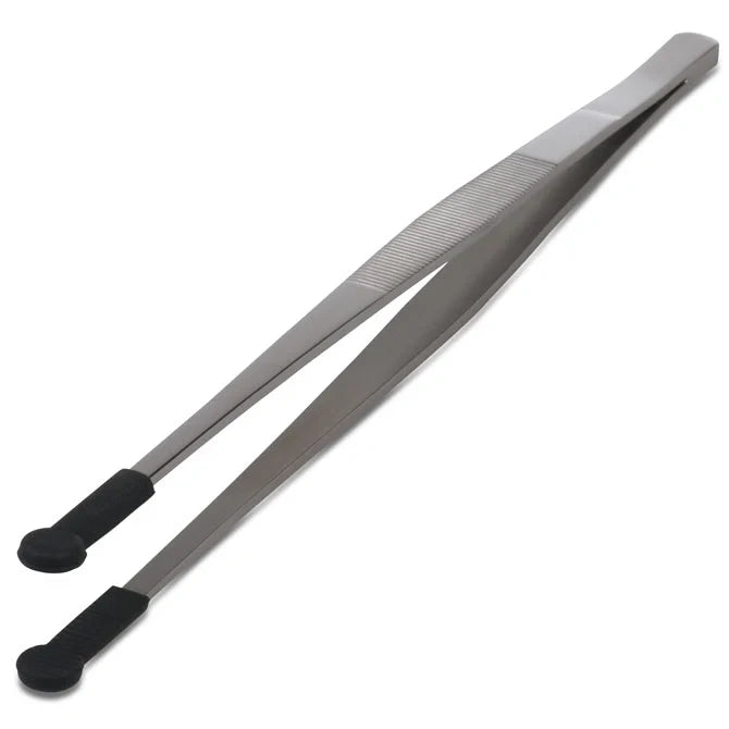 Metallic tweezer with black handles on a white background