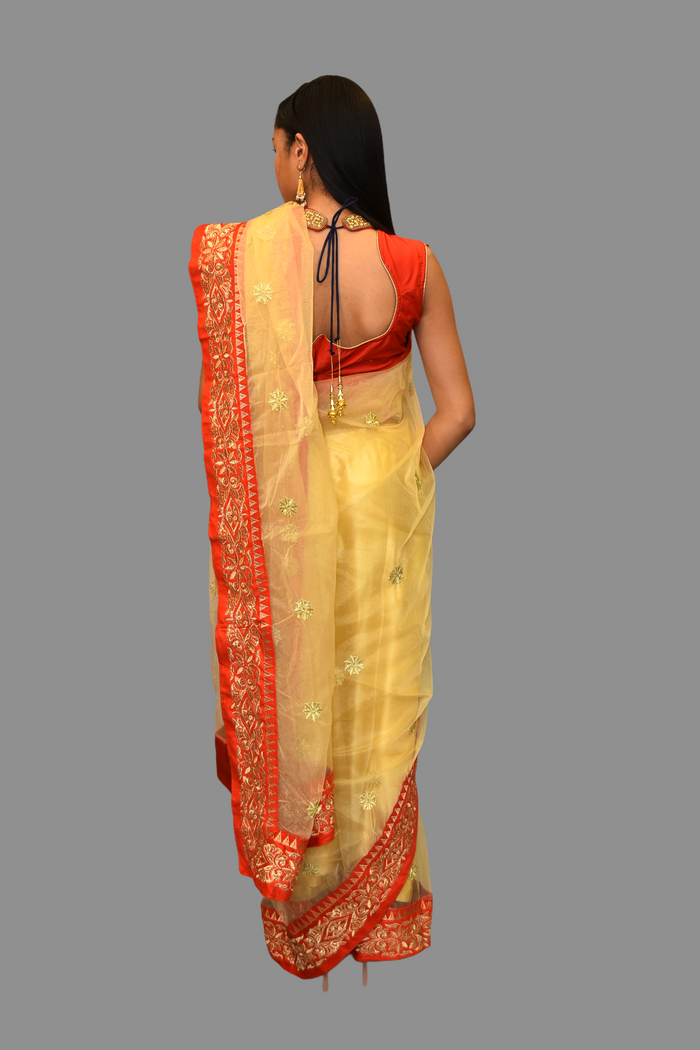 Silk Net Gold Embroidered With Contrast Red Border Saree
