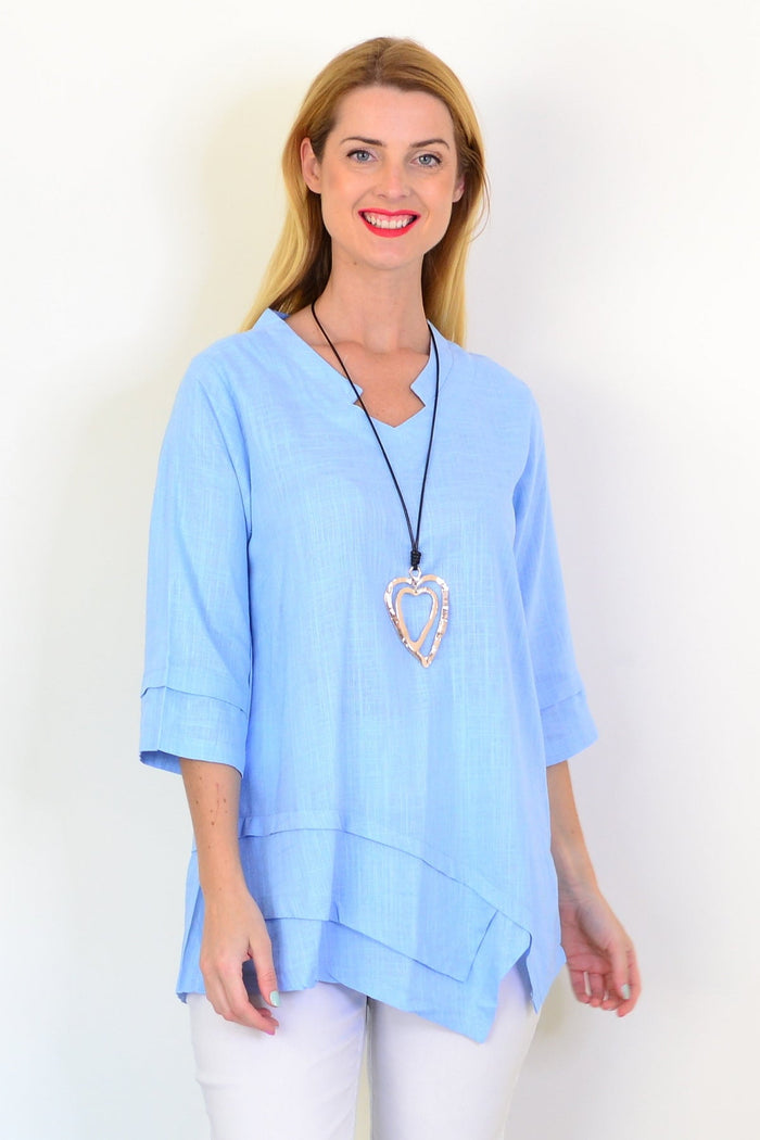 Sky blue linen blend tunic top by Ruby Rain, featuring a relaxed fit with long sleeves and a flowy silhouette.
