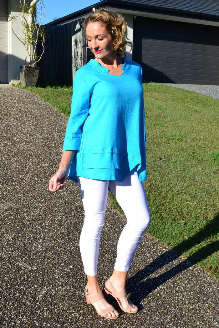 Sky blue linen cotton tunic top by Ruby Rain, featuring a relaxed fit with long sleeves and a casual, breathable design.