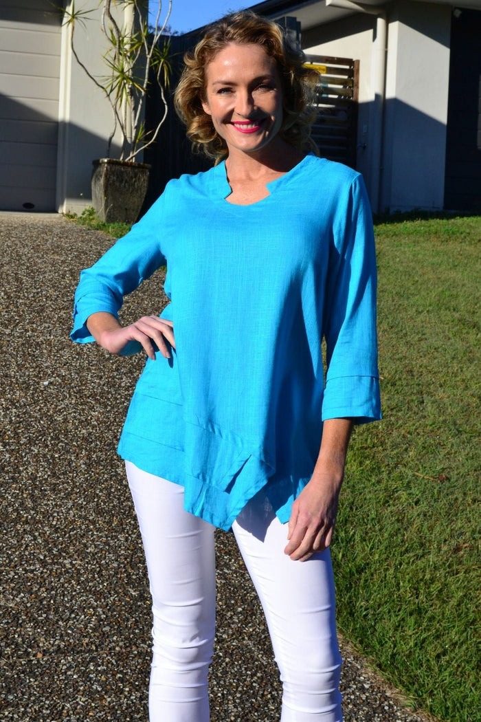 Sky blue linen cotton tunic top by Ruby Rain, featuring a loose fit and lightweight fabric, displayed on a hanger.