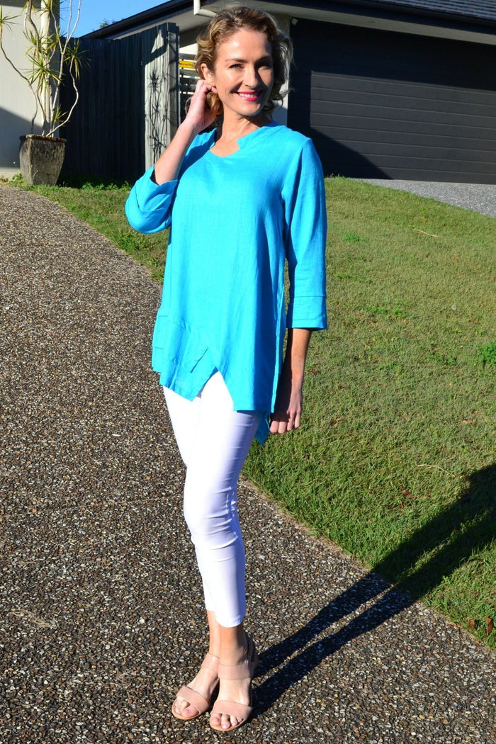 Sky blue linen cotton tunic top by Ruby Rain, displayed flat with long sleeves and a relaxed fit on a white background.