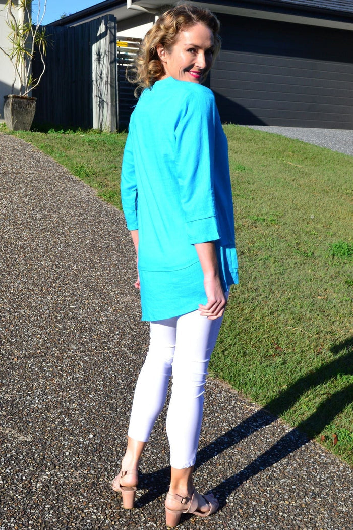 Sky blue linen cotton tunic top by Ruby Rain, featuring a relaxed fit and natural fabric texture, displayed on a hanger.