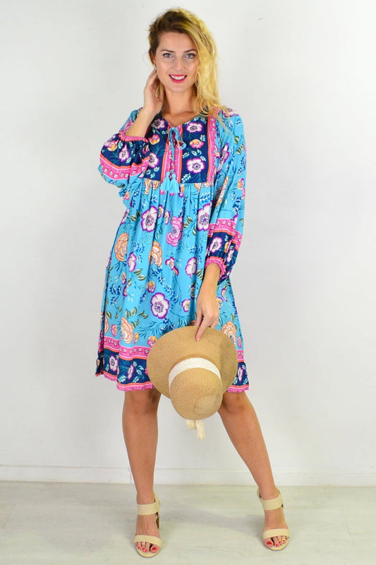 Soft blue Moroccan-style boho tunic dress with intricate patterns, flowing fabric, and relaxed fit by I Love Tunics.
