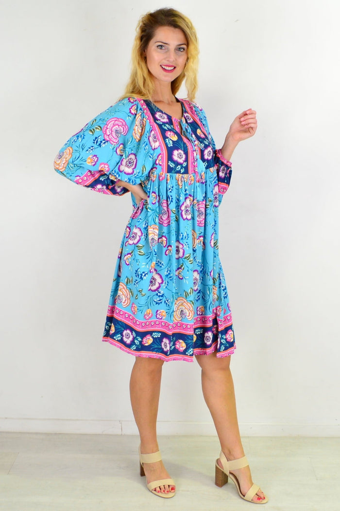 Soft blue Moroccan style boho tunic dress by I Love Tunics, featuring flowing fabric and intricate patterns.