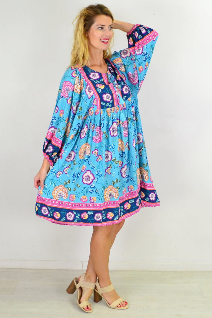 Soft blue Moroccan style boho tunic dress with intricate patterns, flowing fabric, and relaxed fit, perfect for casual and bohemian looks.