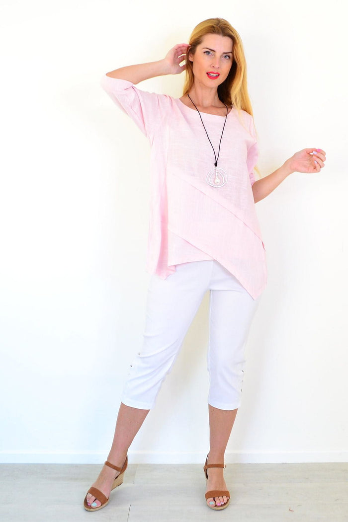 Soft pink linen blend tunic top by Ruby Rain with a relaxed fit and lightweight fabric, shown on a hanger.