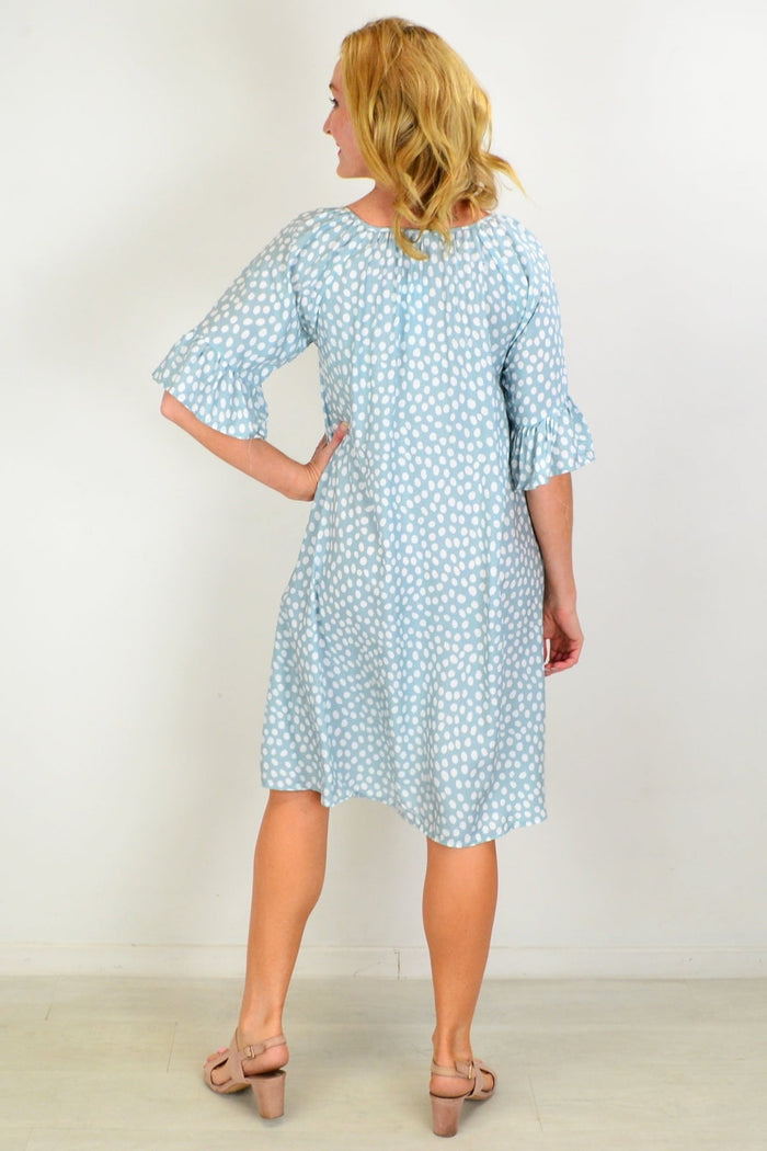 Hourglass spotted garden shift tunic dress shown in the image, featuring a relaxed fit with a floral pattern and short sleeves.