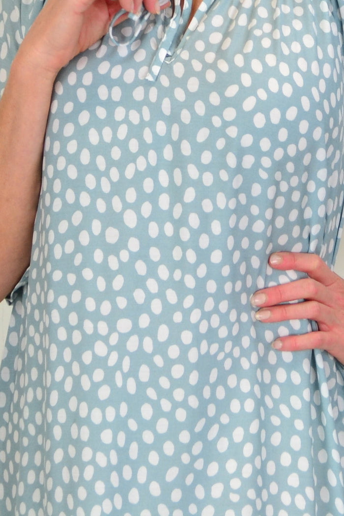 Hourglass Spotted Garden Shift Tunic Dress displayed on a model, featuring a relaxed fit and floral pattern in a casual garden-inspired style.