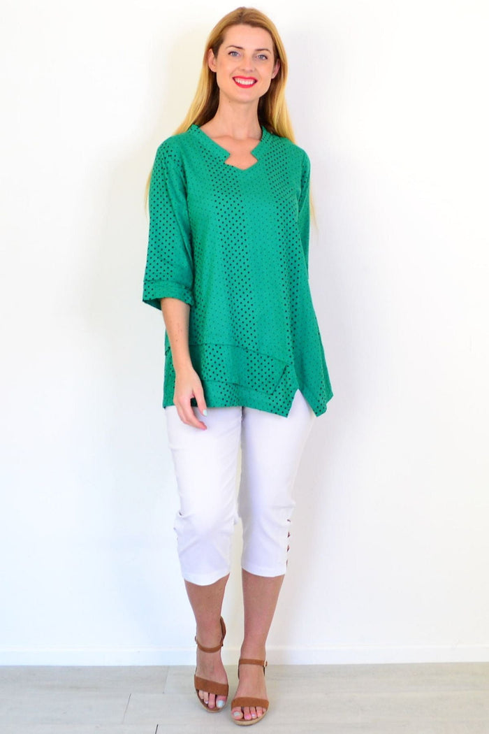 Spotted green linen blend tunic top by Ruby Rain, featuring a relaxed fit and casual style, displayed on a hanger.