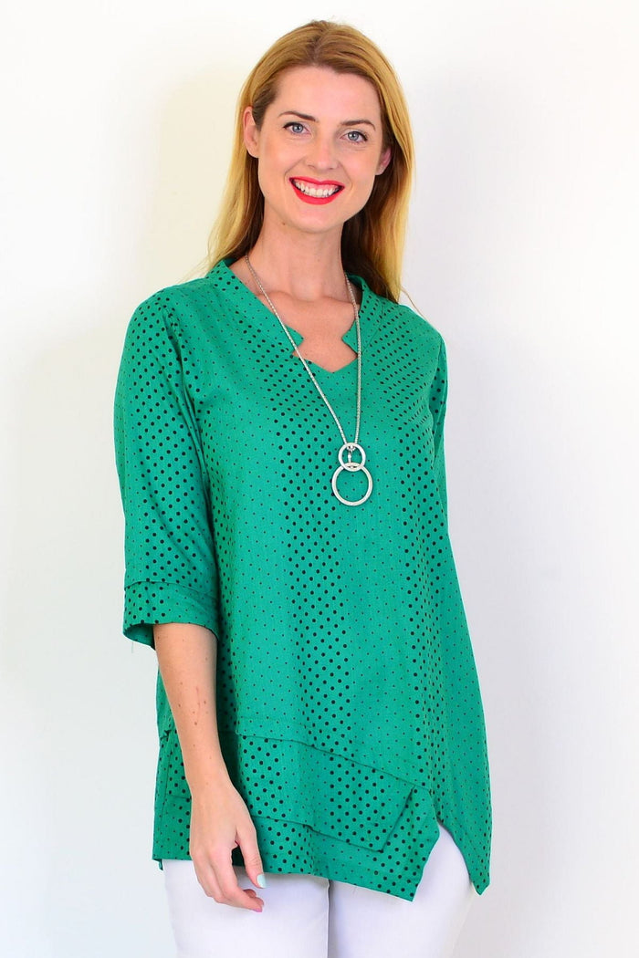 Spotted green linen blend tunic top by Ruby Rain featuring a relaxed fit and casual style, shown on a hanger against a plain background.