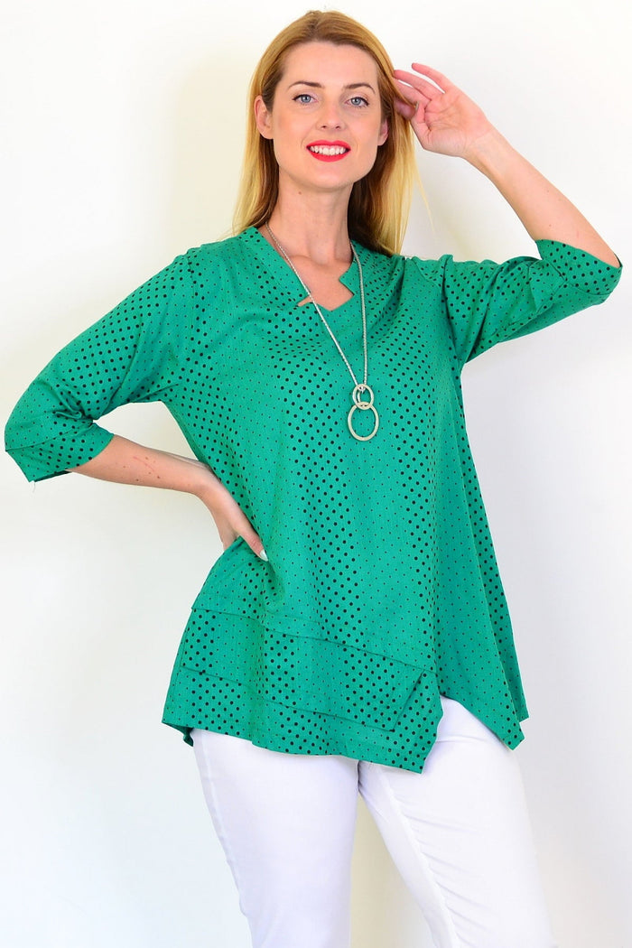 Spotted green linen blend tunic top by Ruby Rain, featuring a relaxed fit and short sleeves, displayed on a hanger.