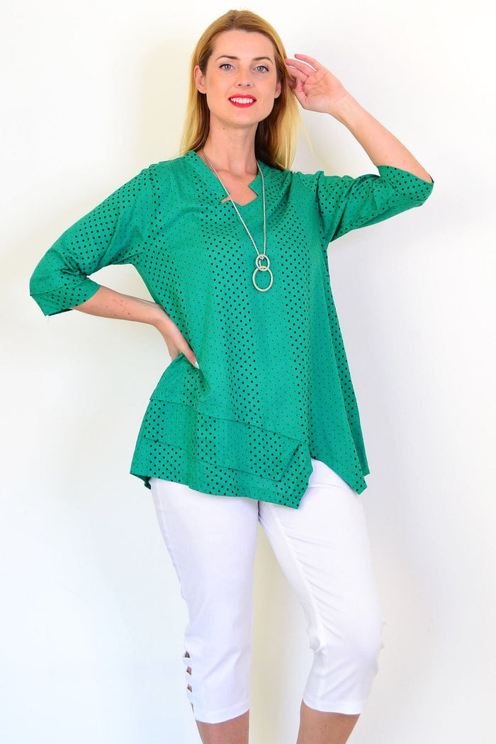 Spotted green linen blend tunic top by Ruby Rain featuring a relaxed fit and short sleeves, displayed on a hanger.