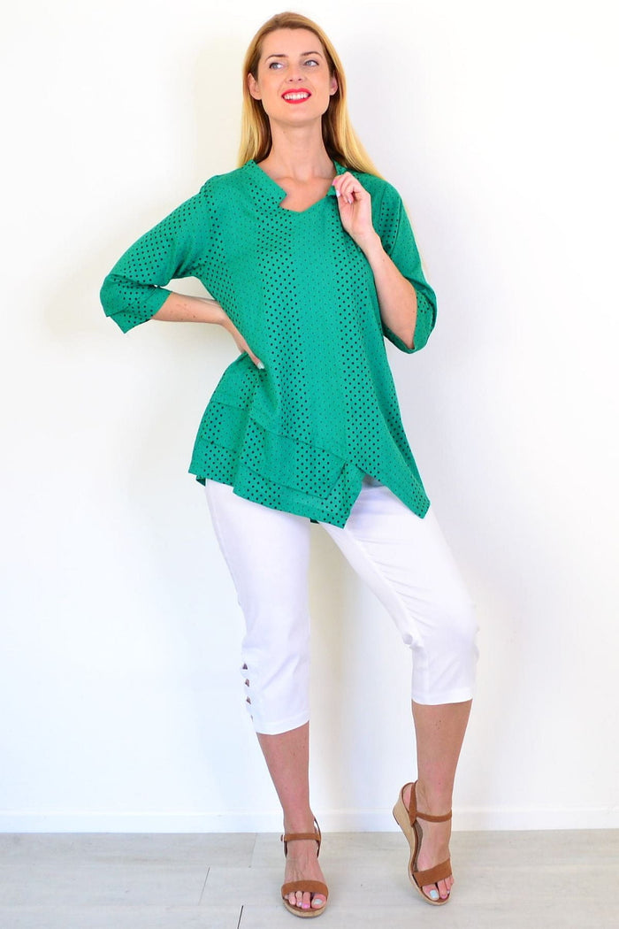 Spotted green linen blend tunic top by Ruby Rain, featuring a relaxed fit and stylish design, shown on a hanger.