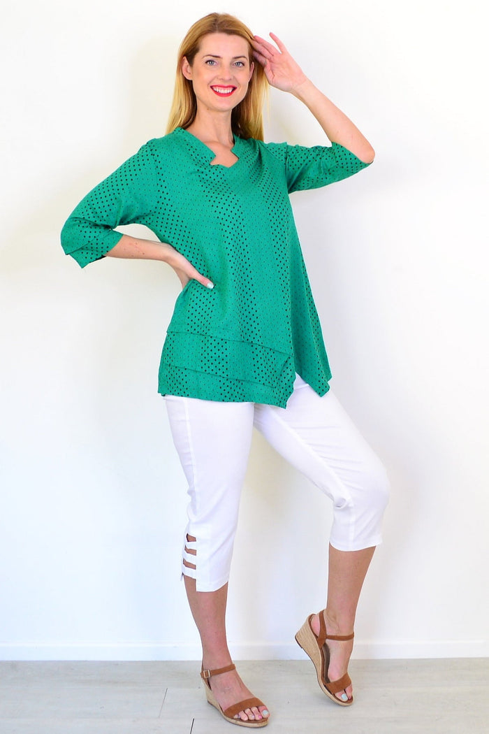 Spotted green linen blend tunic top by Ruby Rain featuring a relaxed fit and lightweight fabric, displayed on a hanger.