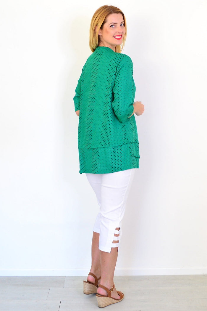 Spotted green linen blend tunic top from Ruby Rain with a relaxed fit and stylish design, displayed on a hanger.
