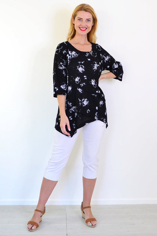 Starburst linen blend tunic top by Ruby Rain featuring a relaxed fit, long sleeves, and a vibrant, colorful starburst pattern.