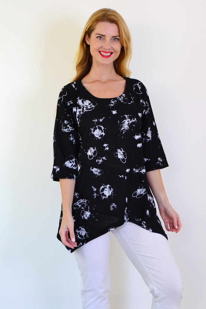 Starburst linen blend tunic top by Ruby Rain, featuring a flowing design and vibrant pattern, displayed on a mannequin.