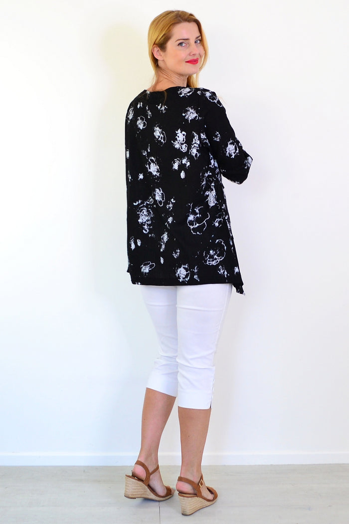 Starburst linen blend tunic top by Ruby Rain featuring a relaxed fit and stylish design on a model.