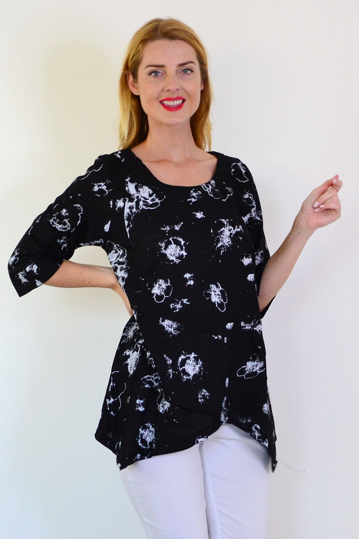 Starburst linen blend tunic top by Ruby Rain featuring a relaxed fit and vibrant pattern, displayed on a hanger.