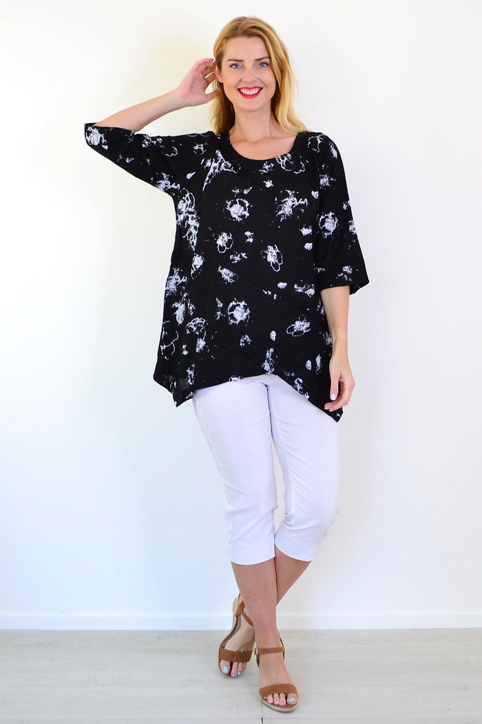 Starburst linen blend tunic top by Ruby Rain, shown hanging with a relaxed fit and vibrant pattern, perfect for casual wear.