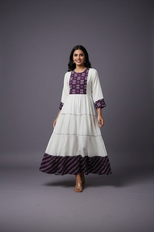 Kurti Connection USA white tiered maxi dress with purple embroidered yoke and cuffs, flowing silhouette.