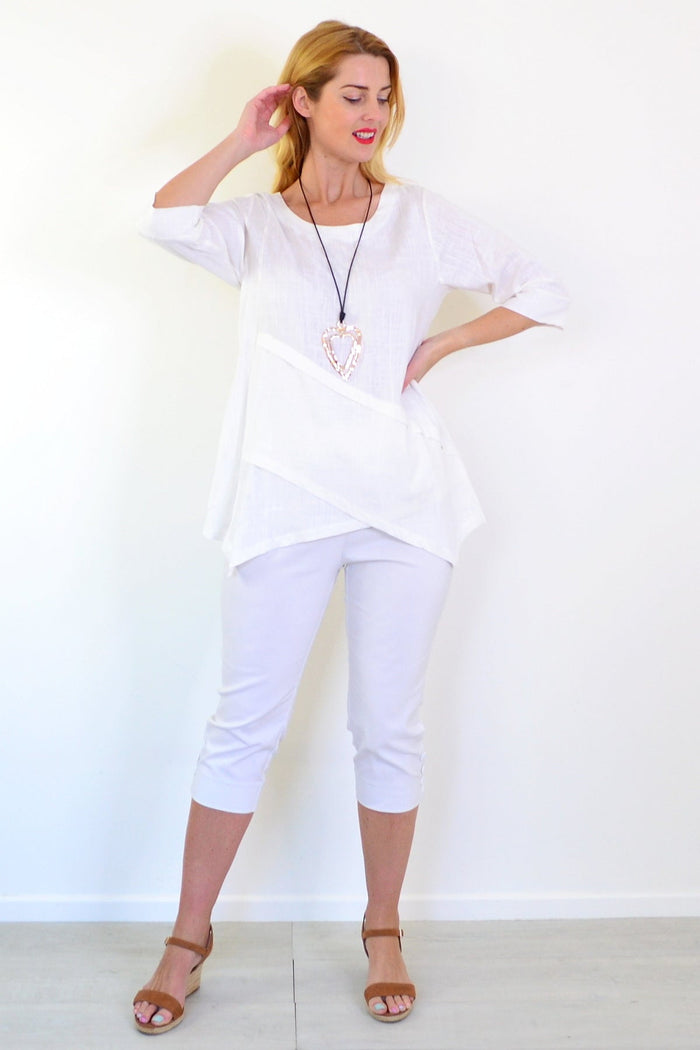 White layered linen blend tunic top by Ruby Rain, featuring a flowy design and casual fit, shown on a model.